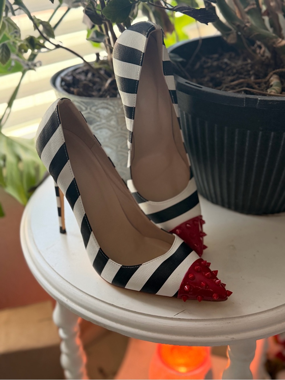 Black & White Striped Pointed-Toe Pumps with Red Studded Cap